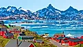 Picturesque village on coast of Greenland - Colorful houses in Tasiilaq, East Greenland