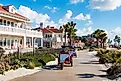 People pedal on bikes past the Hotel del Coronado, California. Image credit: Sherry V Smith / Shutterstock.com.