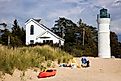 Pictured here: a kayak, lighthouse and beach in Empire, Michigan. 