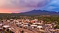 Blue and Orange color swirls around in the clouds at sunset over Flagstaff Arizona