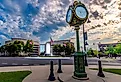“Curt Time” memorial clock and central fountain in front of St. Clair Country Building, Belleville, Illinois. Image credit RozenskiP via Shutterstock