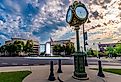 “Curt Time” memorial clock and central fountain in front of St. Clair Country Building, Belleville, Illinois. Image credit RozenskiP via Shutterstock
