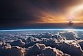 Splendid background cloudscape above the earth's atmosphere in the stratosphere, with a galaxy and black, starry space at the horizon. of view from above the space.