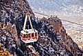 A gondola, on Sandia Peak Aerial Tramway, descends from the top in Albuquerque, New Mexico. Editorial credit: PICTOR PICTURES / Shutterstock.com
