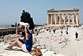 Tourists brave the heat to view the Acropolis in Athens, Greece, Europe's hottest city. Editorial credit: Alexandros Michailidis / Shutterstock.com.