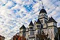 Carthage, Missouri, USA - November 4, 2021: The Carthage Courthouse with fall foliage downtown in one of the best small towns in Missouri. This is one of the most photographed buildings in Missouri.