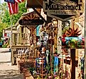 A Boutique Store displays its sales along the sidewalk to entice customers in the charming small town of Nashville, Indiana. Editorial credit: James Kirkikis / Shutterstock.com