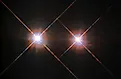 A binary star system containing two red dwarf stars. Image credit: NASA/ESA