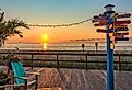 Where to sign on Bethany Beach boardwalk, Delaware. Image credit AZN Media via Shutterstock.