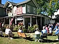 People enjoying a folk music performance in Mountain View, Arkansas. Image credit: Travel Bug / Shutterstock.com.
