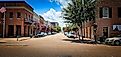 The Main Street lined with brick buildings in Natchez, Mississippi. Editorial credit: VioletSkyAdventures / Shutterstock.com