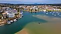 A view of Port Macquarie in NSW surrounded by modern buildings and ships.