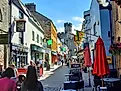 Tourists walking through the streets of Caernarfon, Wales. Image credit: Tom PJ / Shutterstock.com.