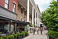 Street scene from historic Saratoga Springs, New York with historic architecture and people in view. Editorial credit: Little Vignettes Photo / Shutterstock.com