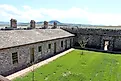 Cove Fort interior, built from volcanic stone. Via Wikimedia Commons / Jllm06, CC BY-SA 4.0.