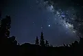 The Milky Way rises above Colorado's San Juan Mountains.