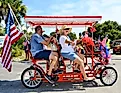 Surrey Bike with an American Flag in a Fourth of July Parade on Edisto Beach. Editorial credit: Coastal Soul Photography / Shutterstock.com