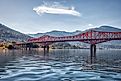 Big Orange Bridge over Kootenay River with Nelson, British Columbia in the background