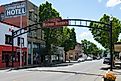 Cottage Grove, OR, USA. Arched sign across East Main Street in Cottage Grove Historic District Oregon