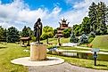 Minot, ND, USA - July 06, 2025: A commanding Viking warrior statue stands prominently in front of the Scandinavian Heritage Park in Minot