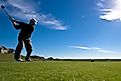 A golfer lines up a drive at The Players Club in Omaha, Nebraska.