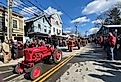 Tractors pass through the small New England town of Chester, Connecticut during a tractor parade. Image credit Joe Tabacca via Shutterstock