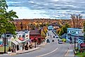Scenic buildings and foliage lined along a street in Sister Bay, Wisconsin. Image credit Nejdet Duzen via Shutterstock