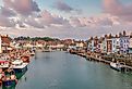 Boats at sunset in Weymouth, Dorset, UK.