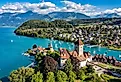 Spiez Church and Castle on the shore of Lake Thun in the Swiss canton of Bern at sunset, Spiez, Switzerland.
