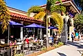 People enjoying an alfresco meal outside a restaurant in downtown Venice, Florida