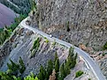 A lone vehicle drives along the dangerous Million Dollar Highway at Ouray, Colorado
