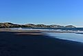 Wainui Beach with great view of nearby mountain ridges in Gisborne, Hawkes Bay, New Zealand. 