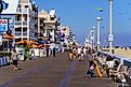 People walk on the Ocean City Boardwalk in Ocean City, Maryland. Image credit: George Sheldon / Shutterstock.com.