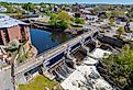 Woonsocket Falls Dam and Glenark Mills building on Blackstone River aerial view in downtown Woonsocket, Rhode Island.