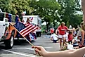 Waving an American flag at the Independence Day Parade on the 4th of July 