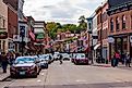 Busy Main Street in the historic downtown area of Galena, Illinois, USA, bustling with cars and people. Editorial credit: Dawid S Swierczek / Shutterstock.com