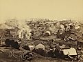 General view of Johnstown from high ground after the flood of May 31st, 1889. Horse drawn wagons and men work in the central mid-ground, possibly recovering bodies Editorial credit: Everett Collection / Shutterstock.com 