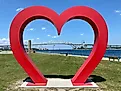 A heart sculpture frames the Blue Water Bridge, an international crossing shared by Michigan and Ontario.