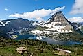 The scenic view of the lake and mountains in Glacier National Park on a sunny day