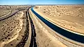 Dramatic aerial view of the all-American canal traveling through the Buttercup sand dunes in imperial county California.