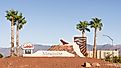 A Mesquite, Nevada welcome sculpture and palm trees fronts the Casa Blanca Resort & Casino. Editorial credit: Steve Lagreca / Shutterstock.com