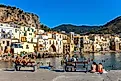 People on the beach of Cefalu, Italy. Image credit: rui vale sousa / Shutterstock.com.