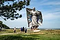 People gather around the Dignity Statue in Chamberlain, South Dakota.