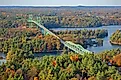Thousand Islands Bridge across St. Lawrence River in fall in Thousand Islands National Park.