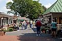 Shoppers browse the storefronts of Kitchen Kettle Village in Bird-In-Hand, PA
