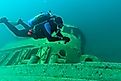 Diver exploring a shipwreck in Grand Island Harbor Bay, Lake Superior. 
