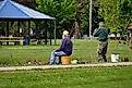 A group enjoying some lake fishing in Tomah, Wisconsin as part of a community event. Editorial credit: Aaron of L.A. Photography / Shutterstock.com