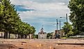 Horizontal photo of the old downtown area of Cottonwood Falls, KS with the courthouse at the end of the street.