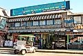 Shops and restaurants are open for business along the Gulf of Mexico waterfront in Cedar Key, Florida. Image credit Leigh Trail via Shutterstock