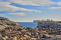 People gather at a viewpoint along the coastline of Albany, Western Australia. Image: PhotopankPL / Shutterstock